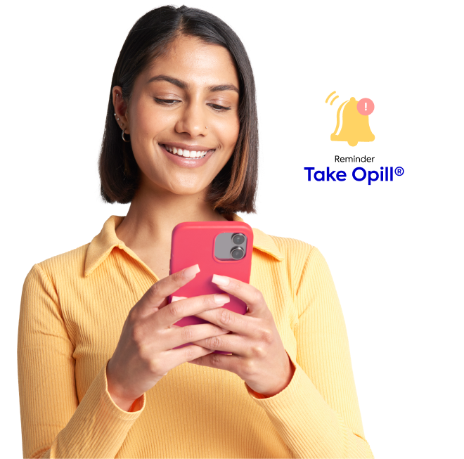 Woman setting a reminder to take Opill