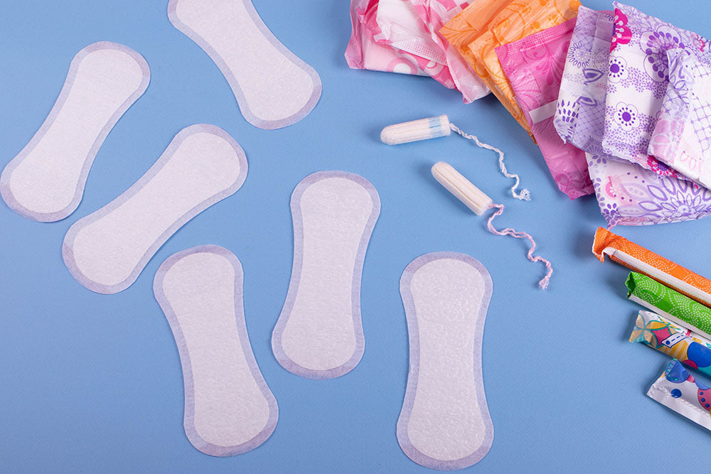 Assorted feminine products are lying scattered